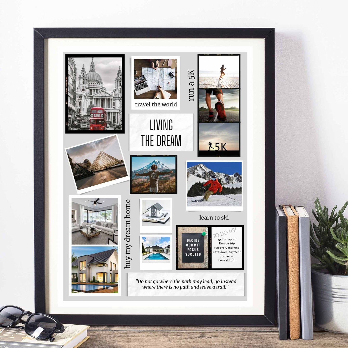 Scrapbook design vision board in frame on desk with books